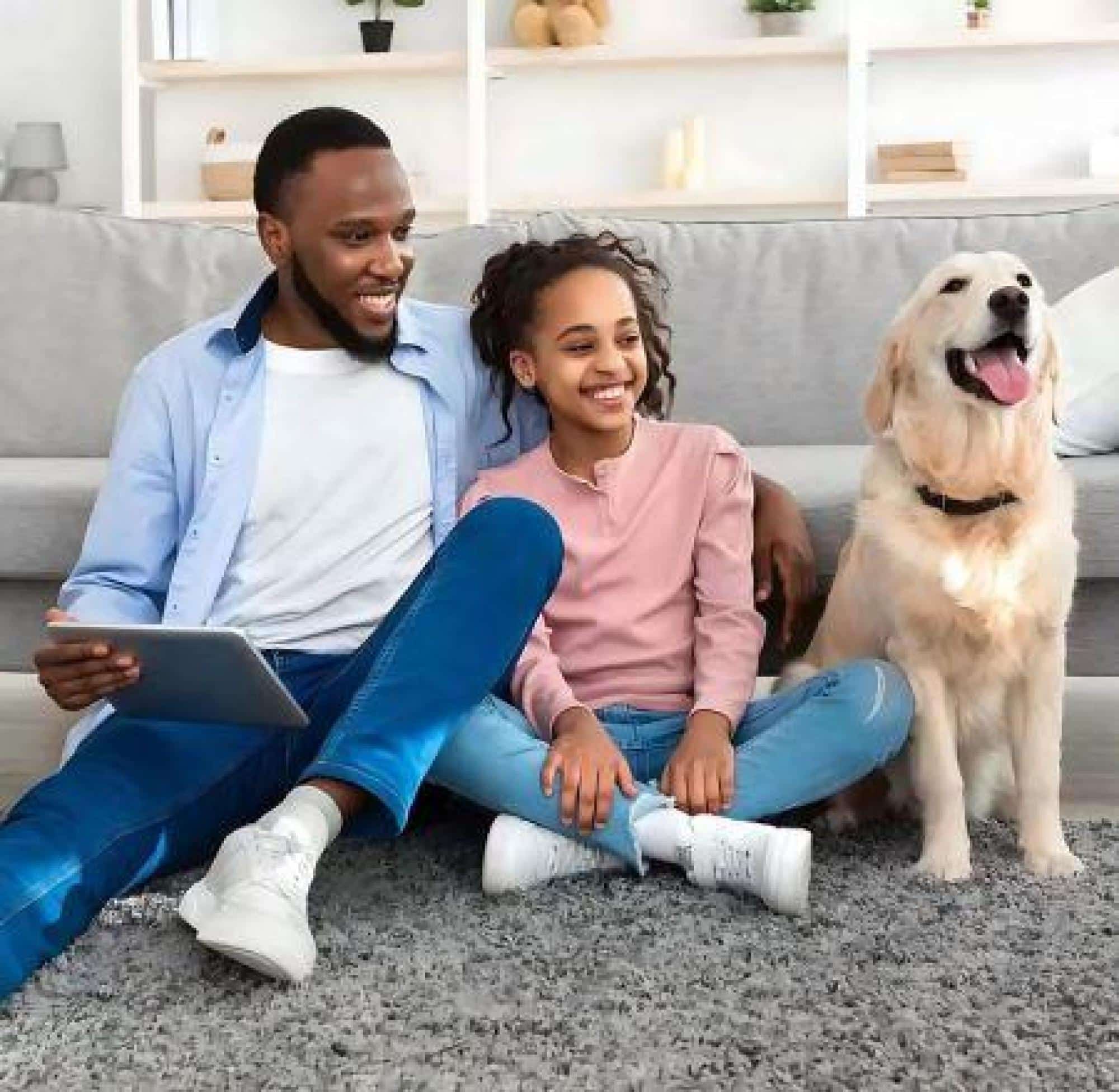 Family With A Dog Enjoying A Comfortable Home