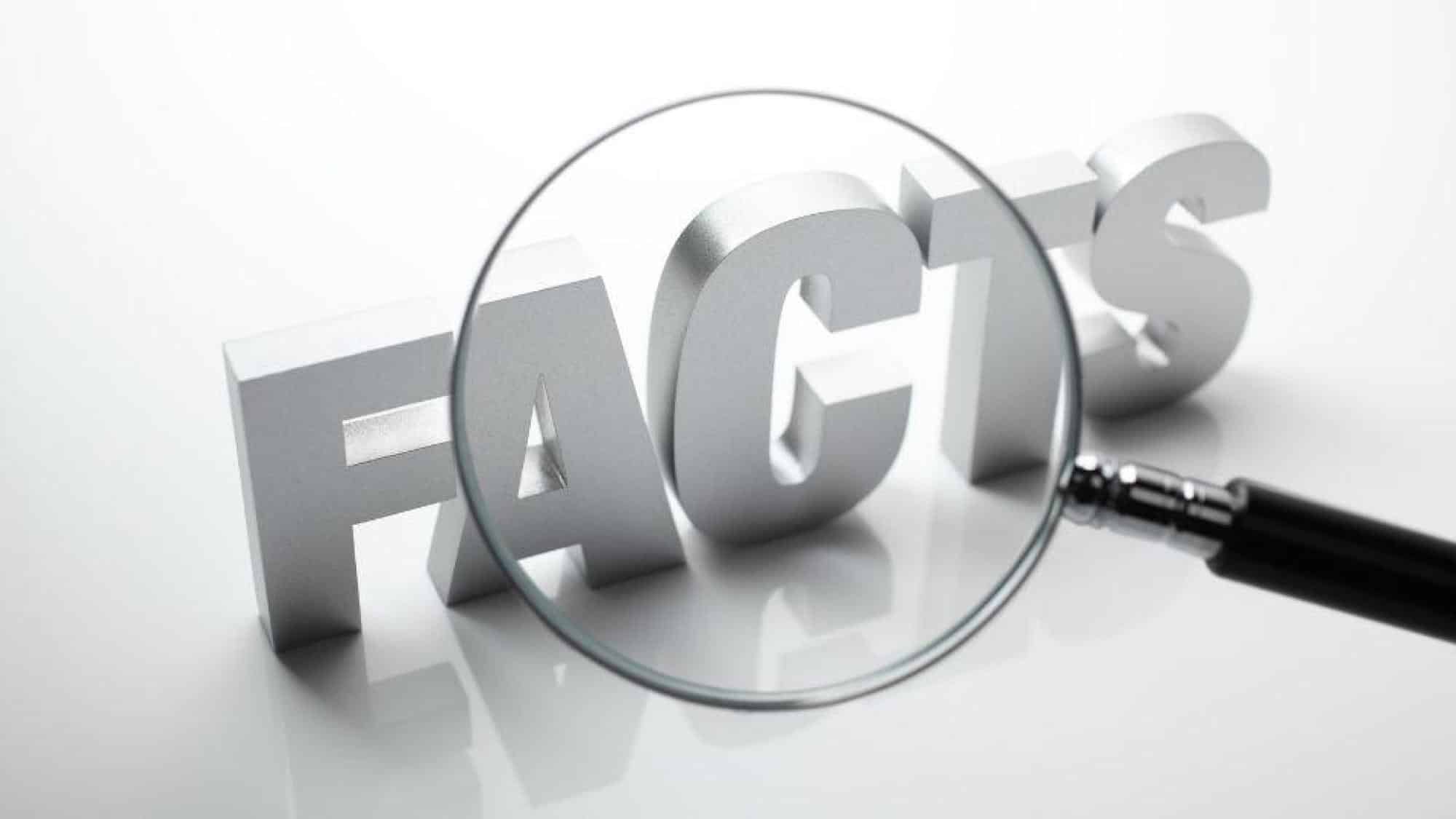 Magnifying glass looking at "facts" text about air conditioners