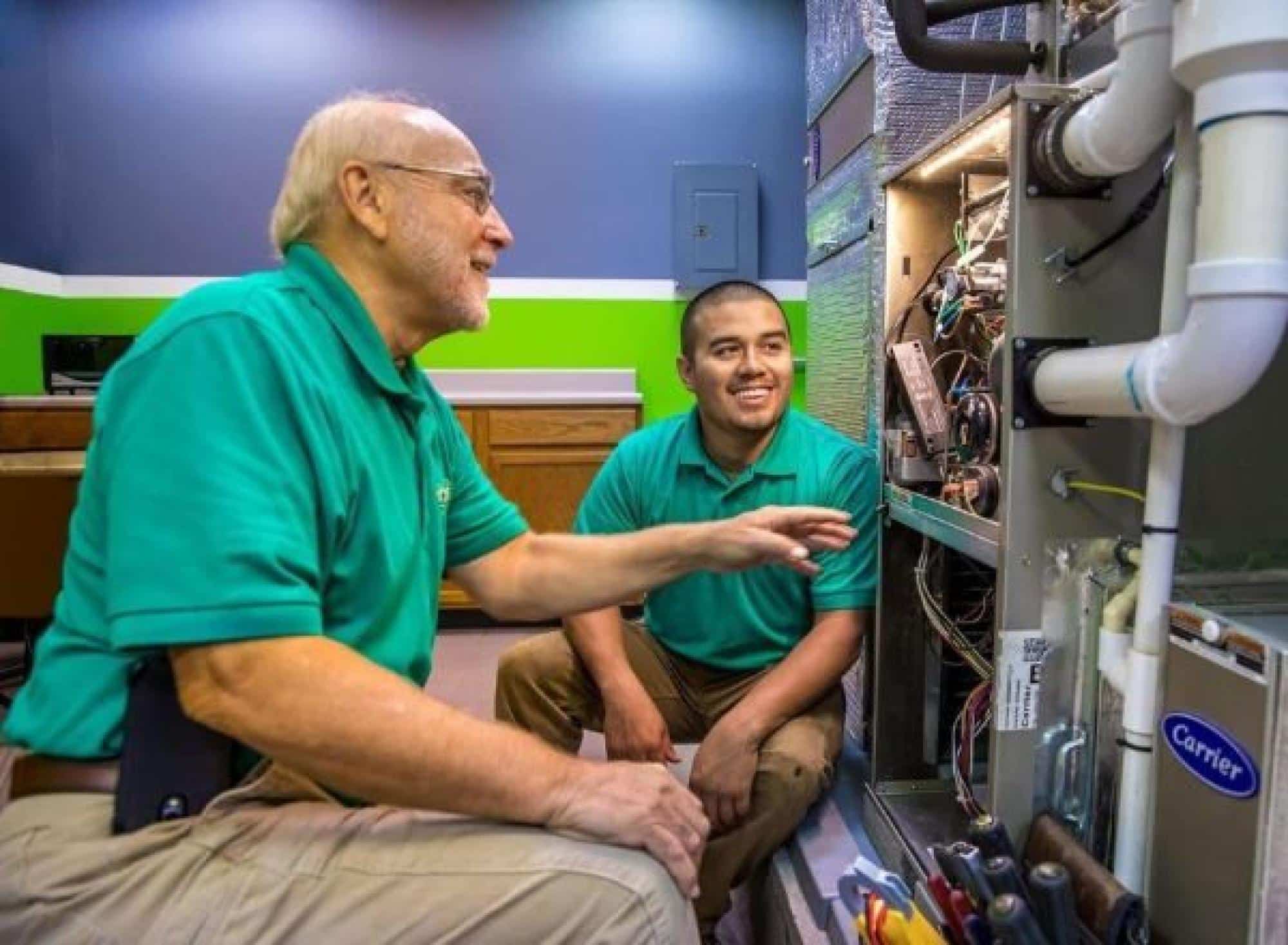 Technicians Working On HVAC System