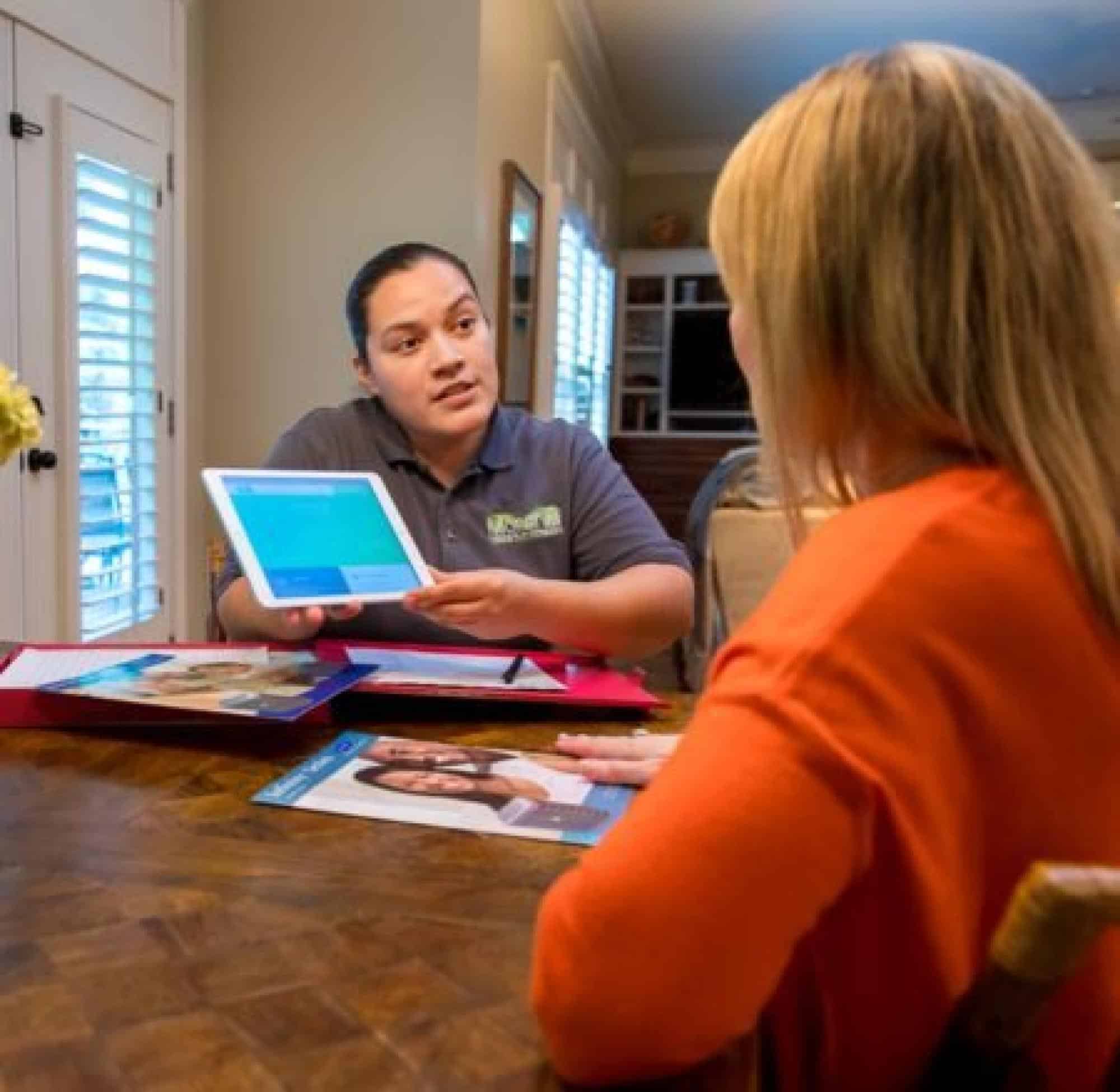 HVAC Technician Consulting A Customer
