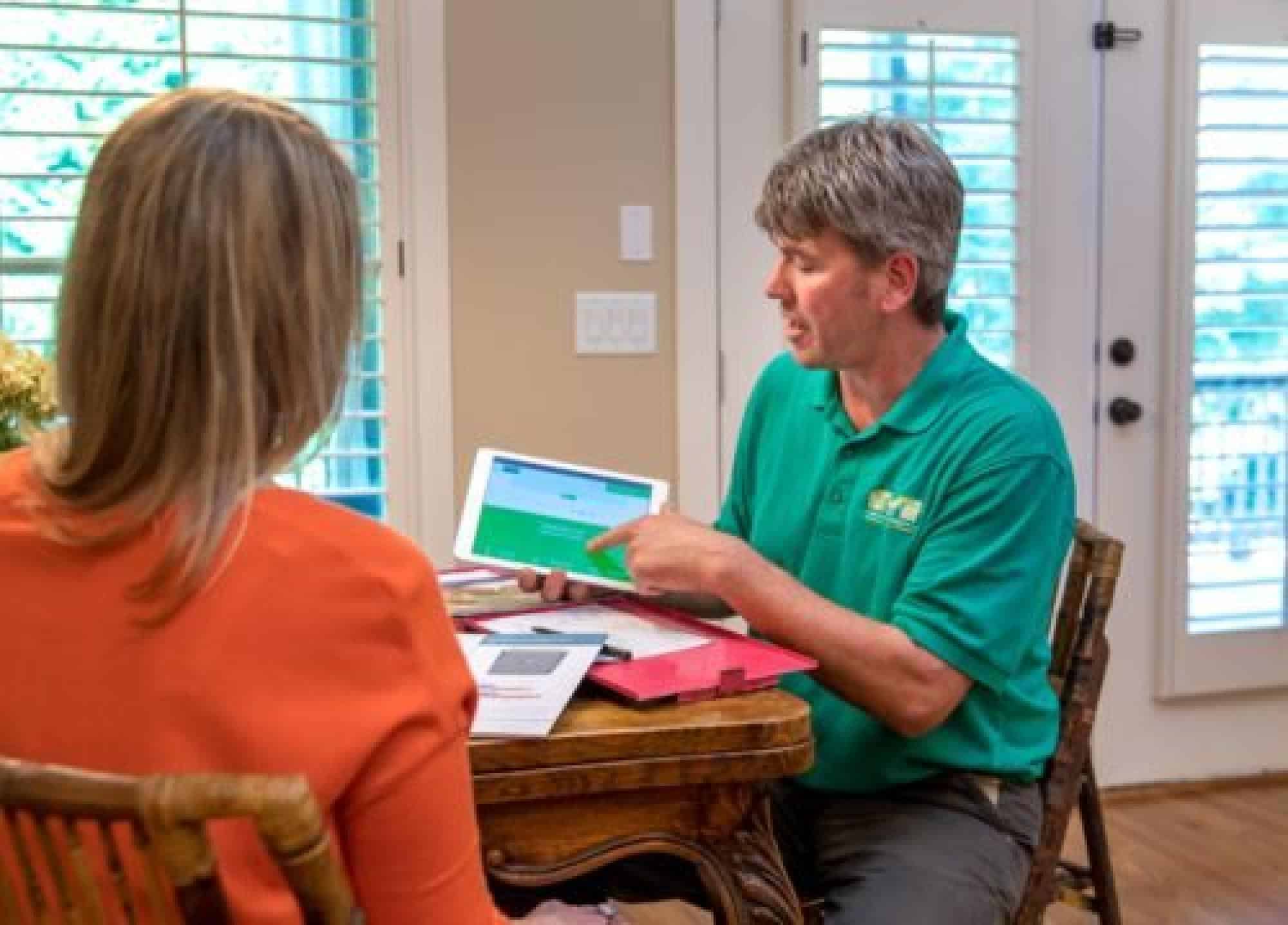 HVAC Technician Discussing Options With Their Client