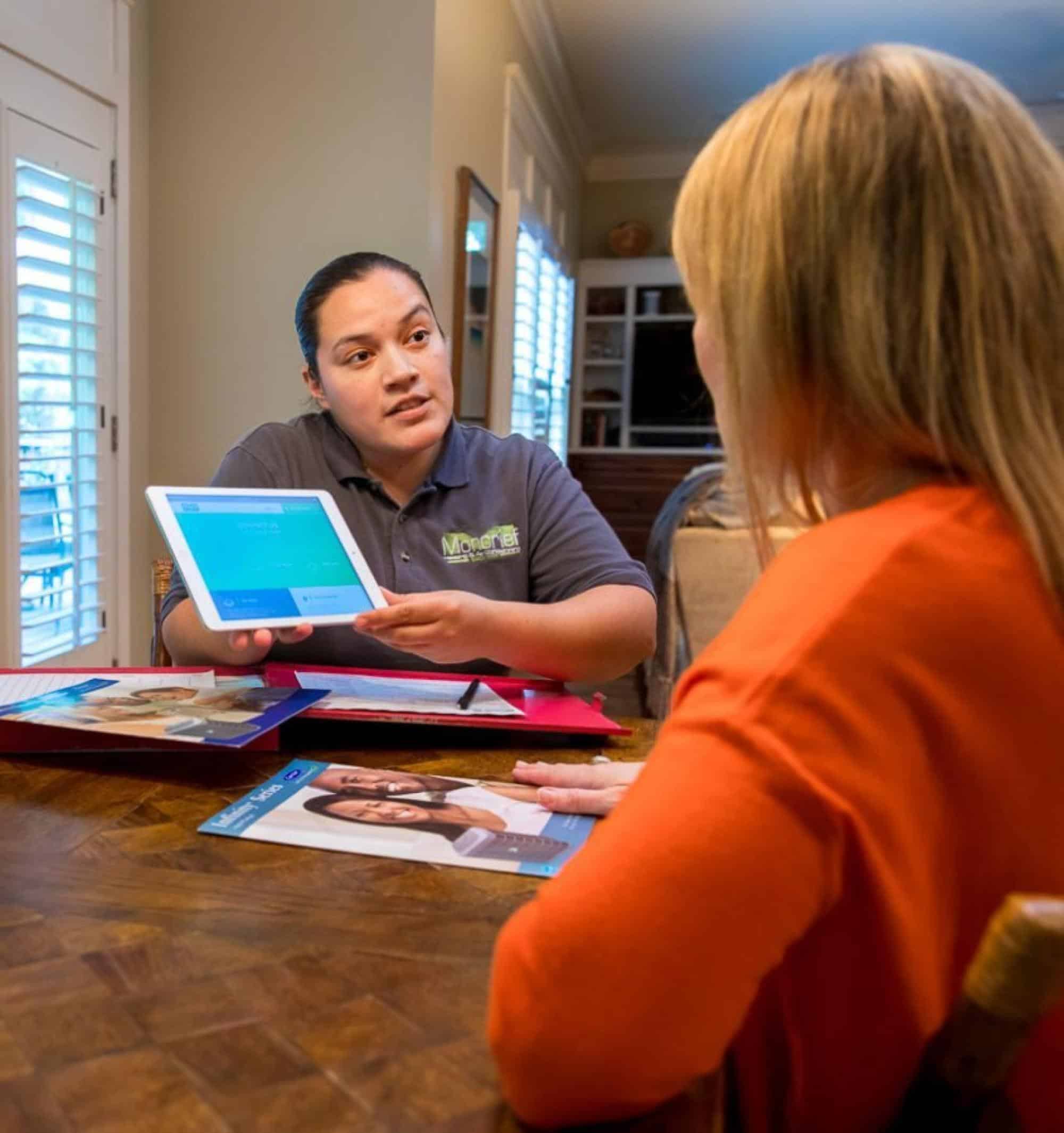 HVAC Technician Discussing Options With Their Client