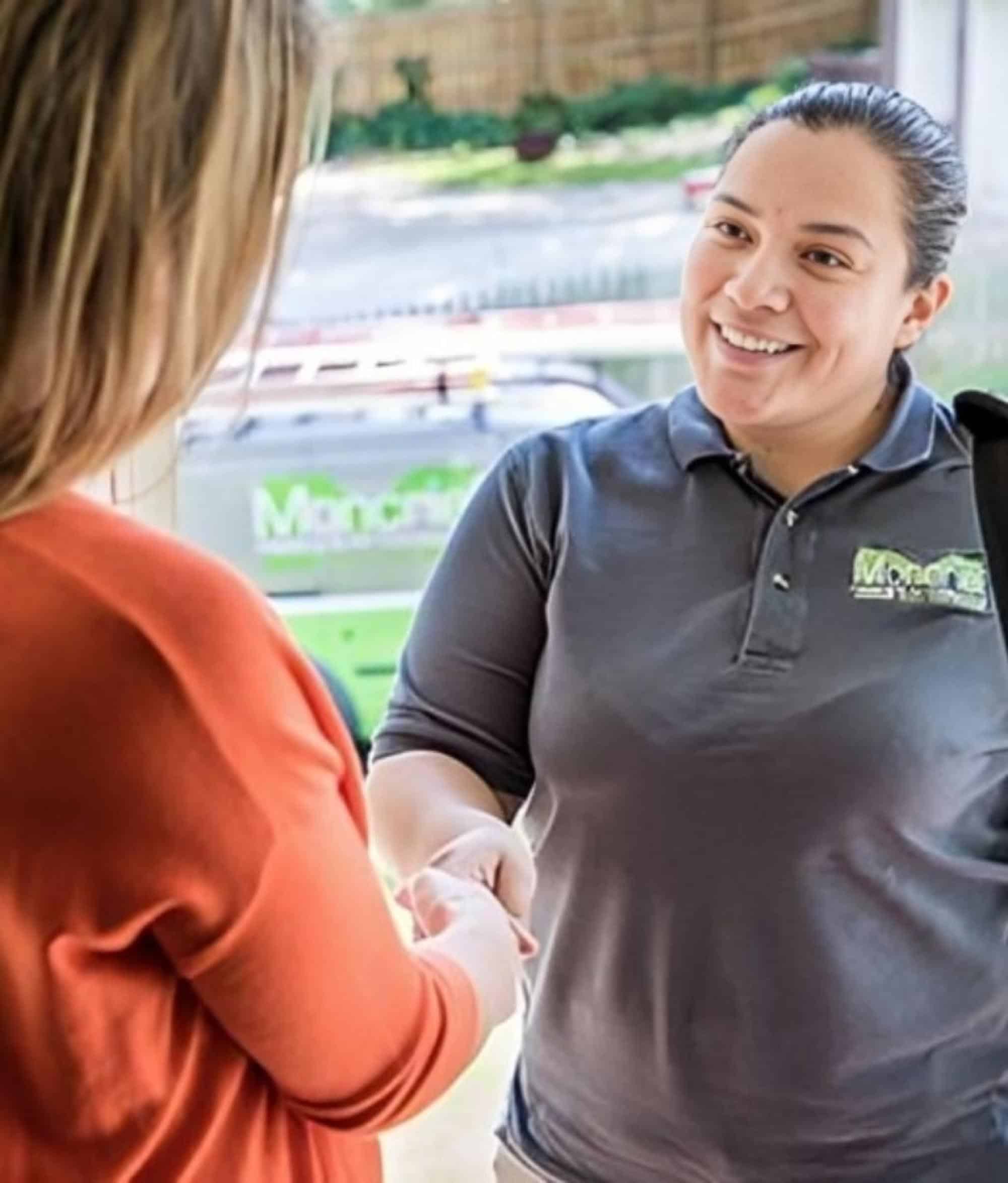 HVAC Technician Discussing Shaking Hands With Client