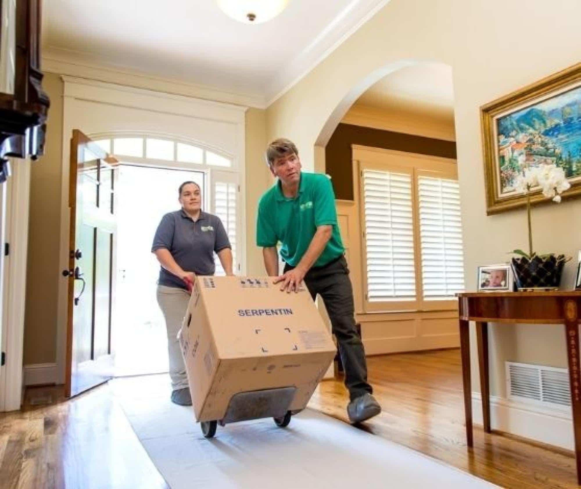 HVAC Technicians Delivering Appliance Box