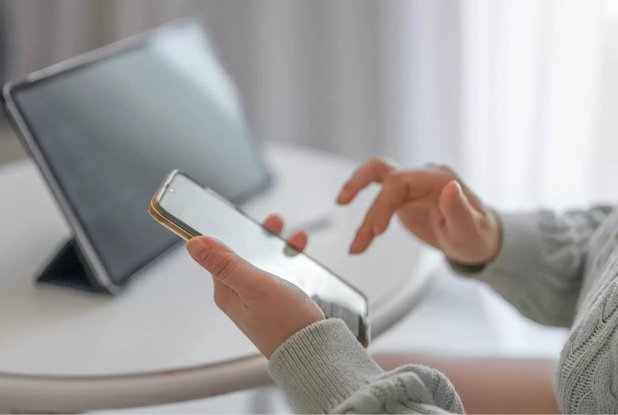 Person using their phone to schedule an appointment with Moncrief Heating and Air