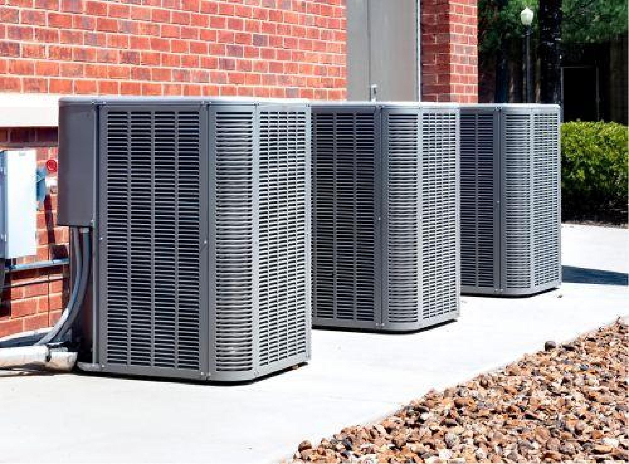 Outdoor HVAC Units Installed On A Concrete Surface