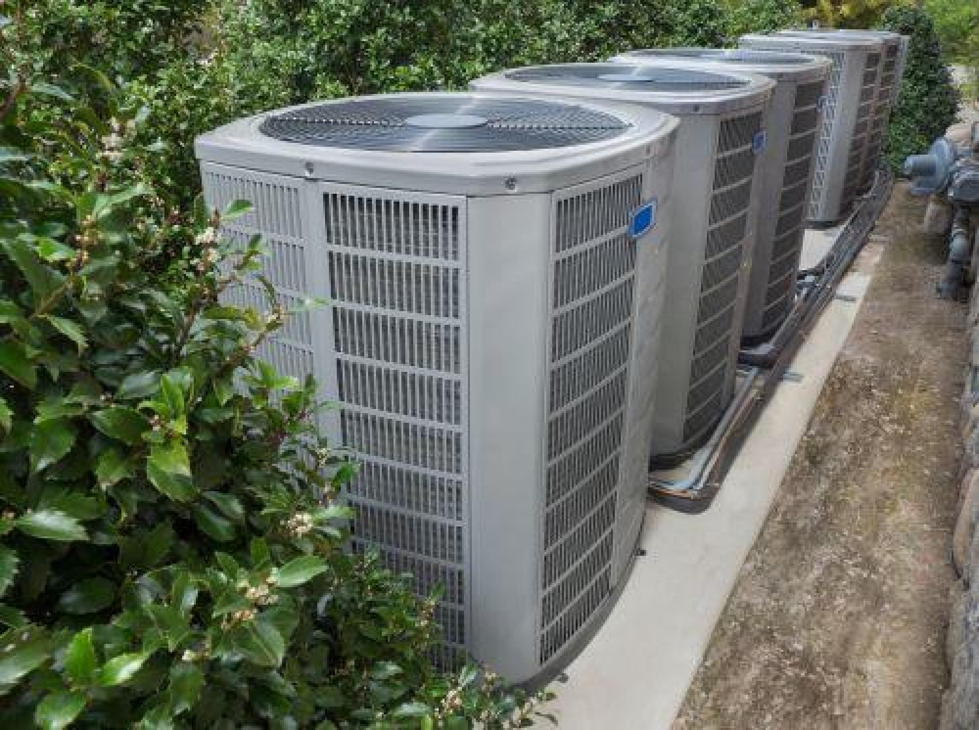 Outdoor HVAC units Surrounded By Shrubs