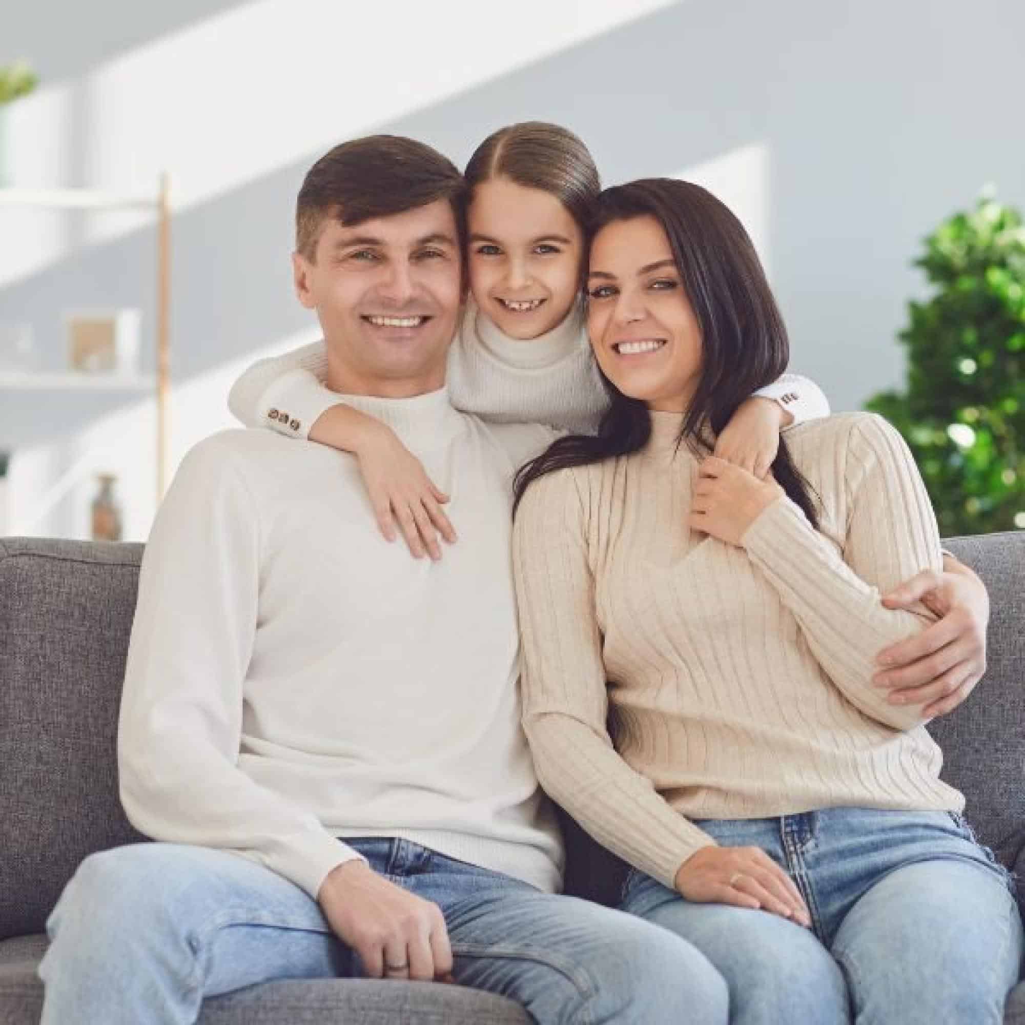 Smiling Family Sitting Together