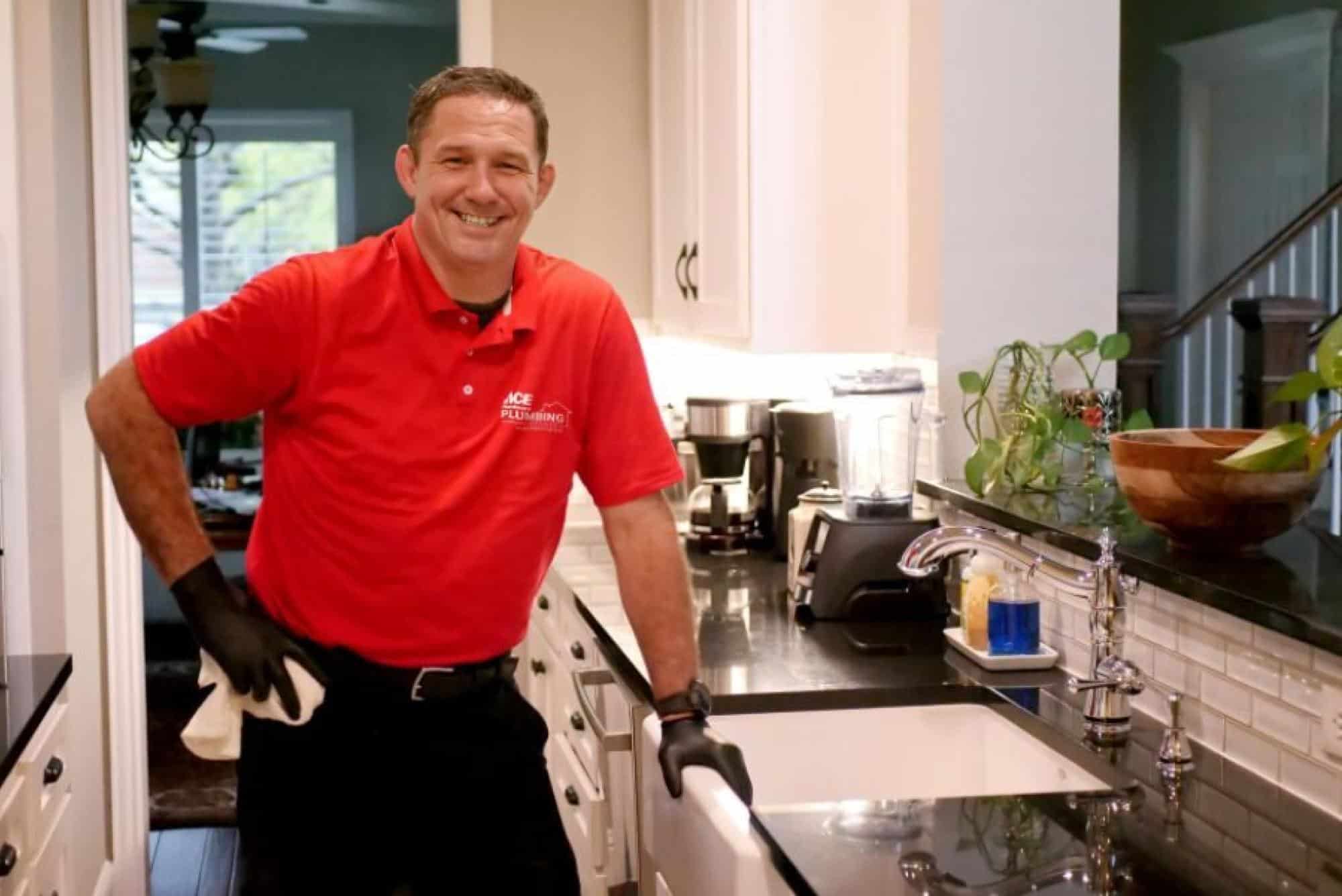 Technician Standing Near Kitchen Sink