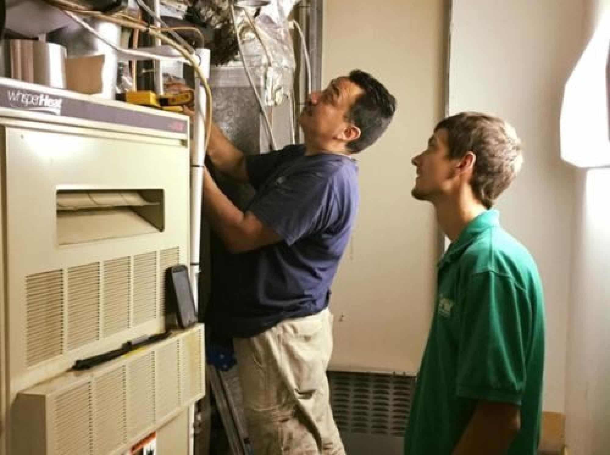 Technician Working On HVAC System
