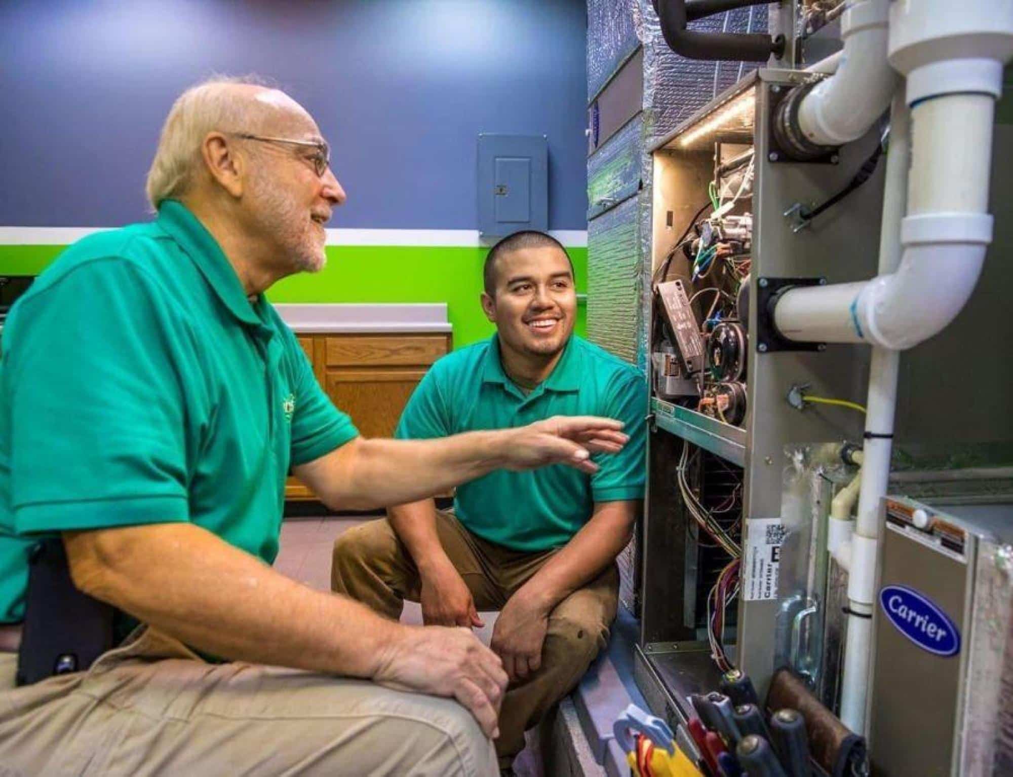 Technicians Working On HVAC System